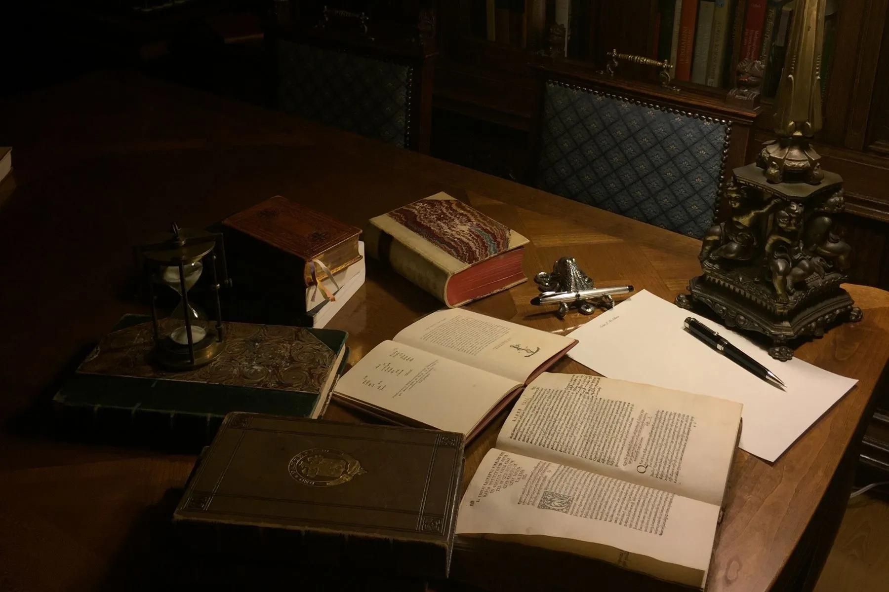 moody image of open books on a desk